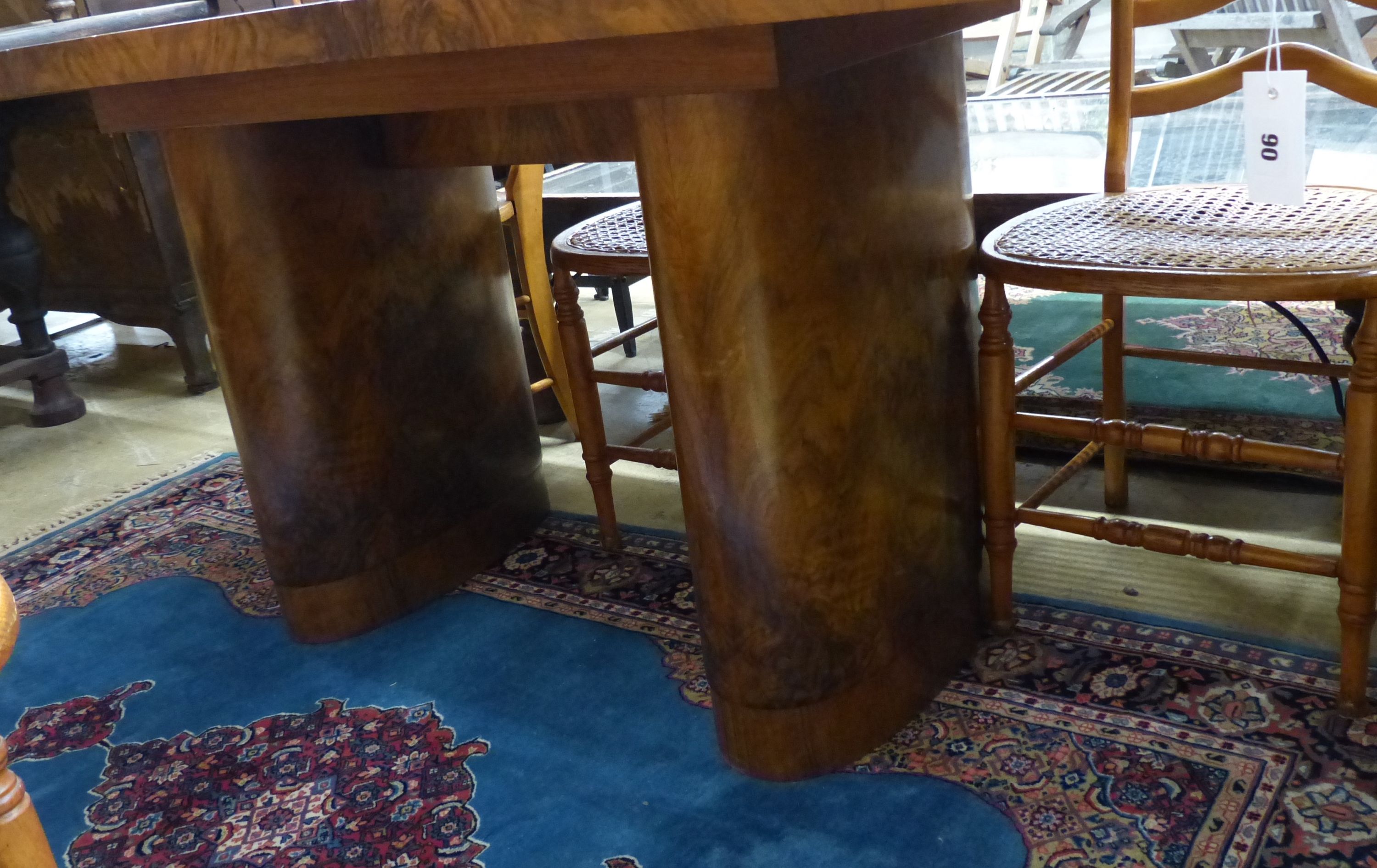 An Art Deco figured walnut extending dining table with one leaf, extends to 199cm, width 92cm